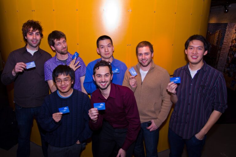 Group of people holding blue Seattle ORCA transit cards — Seattle ORCA card guide
